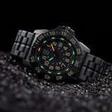 Three-quarter angle view of the Luminox Navy SEAL Men's 45mm Quartz Watch XS.3510 showing the case profile and screw-in crown. This Navy SEAL 3500 Series watch features a lightweight black CARBONOX™ case and a black dial with luminous hands.