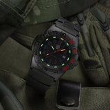 Luminox Navy SEAL 3550 Men’s 44mm Quartz Watch XS.3565 shown in a rugged outdoor setting. This Navy SEAL 3550 Series dive watch features a black and red dial, a lightweight CARBONOX™ case and 200m water resistance.