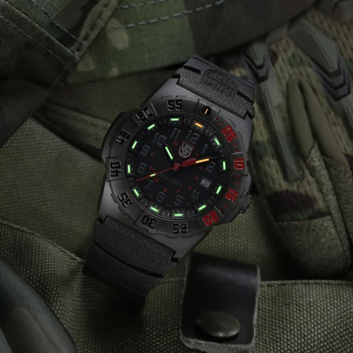 Luminox Navy SEAL 3550 Men’s 44mm Quartz Watch XS.3565 shown in a rugged outdoor setting. This Navy SEAL 3550 Series dive watch features a black and red dial, a lightweight CARBONOX™ case and 200m water resistance.