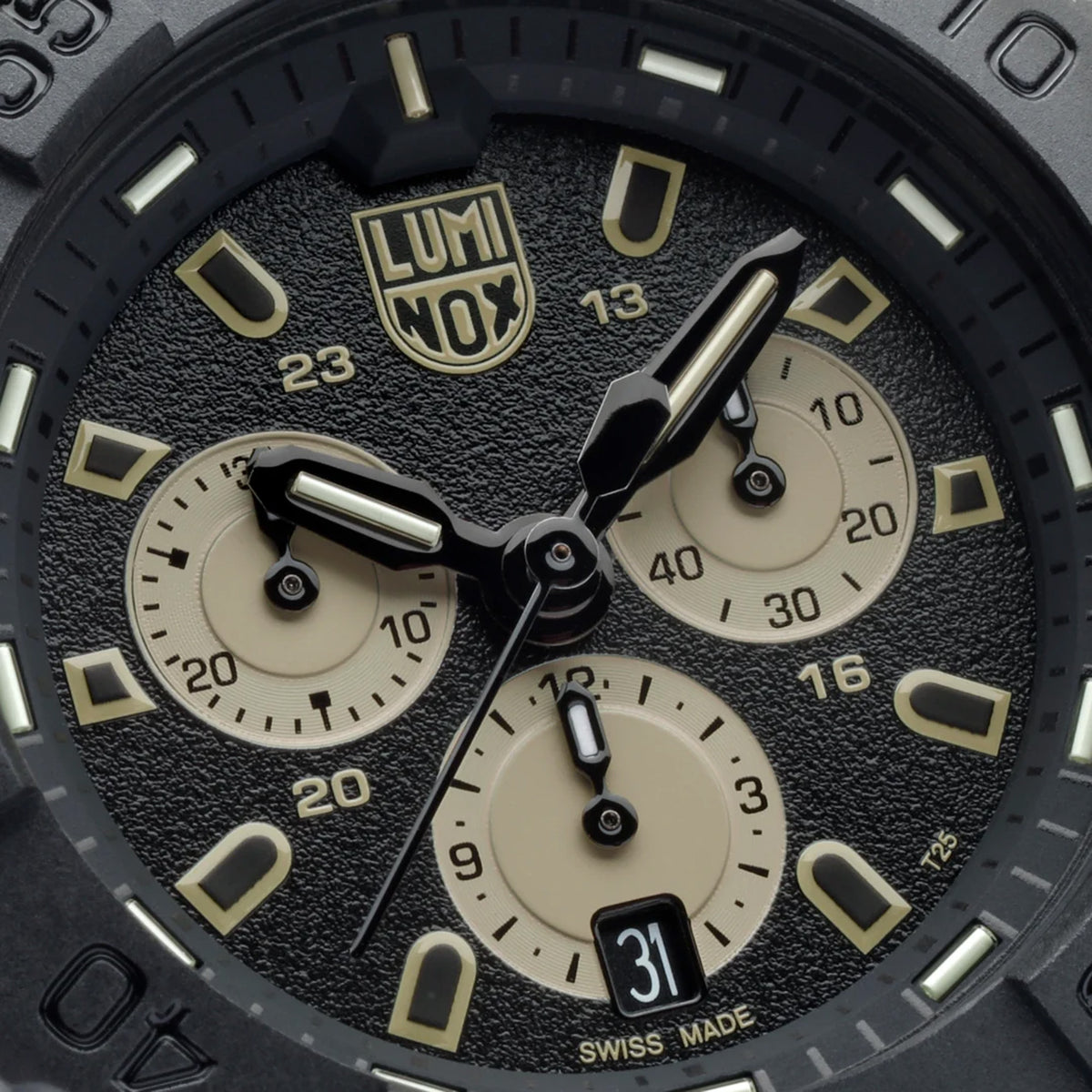 Close-up of the black dial on the Luminox Navy SEAL Chronograph Men’s 45mm Quartz Watch XS.3587, showing the sand-coloured chronograph sub-dials and markers, luminous hands and date window. This Navy SEAL Chronograph 3580 Series watch features self-powered tritium tubes for constant visibility in the dark.