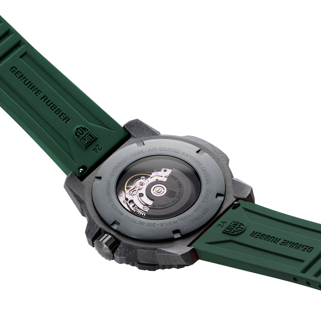 The back of the case of Luminox watch with a green band