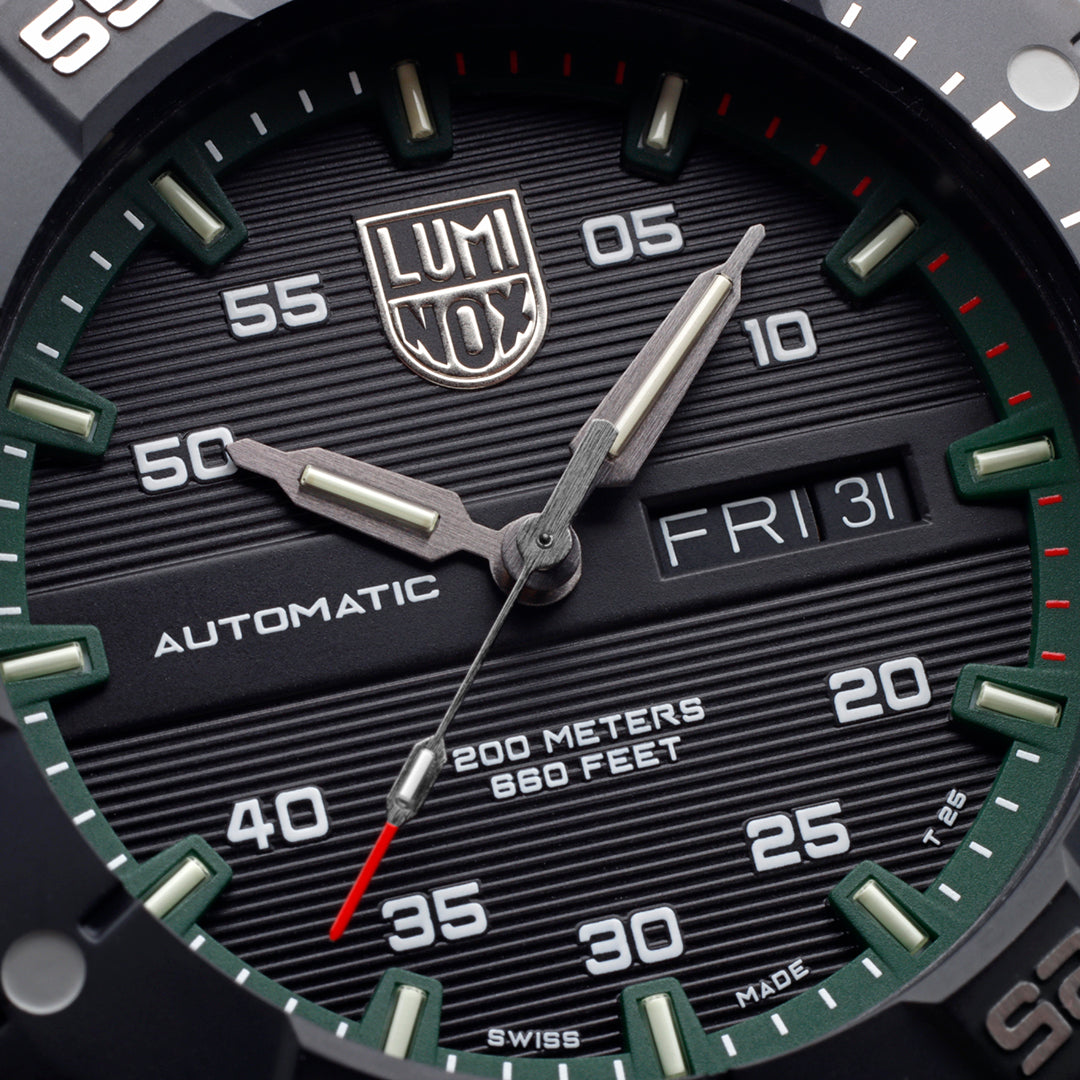 Close up of a Black and green Luminox Watch dial