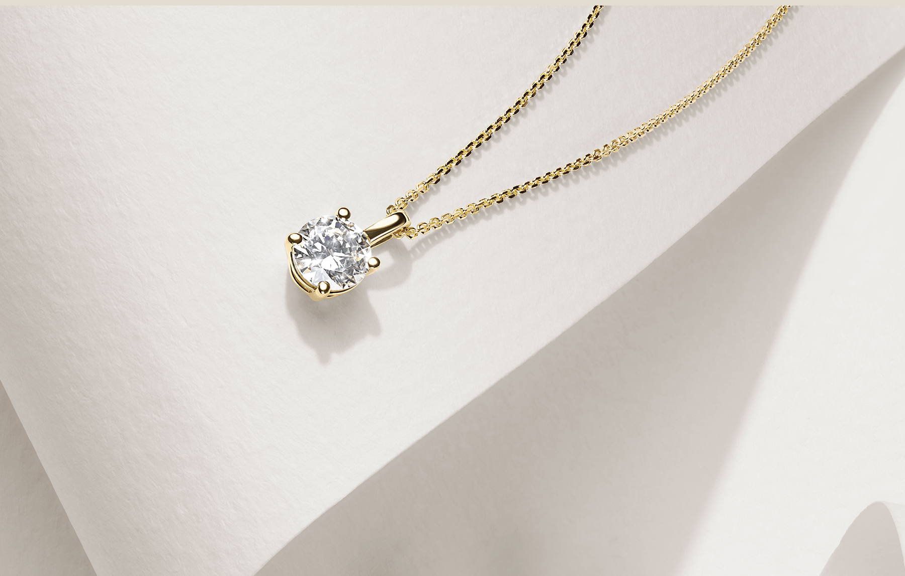 Round Diamond Pendant on a Gold Chain