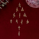 The Wallace Bishop Zodiac Pendants, including the Aries pendant, reference 3PZARIY, with all twelve zodiac signs shown without chains and arranged in the shape of a Christmas tree.