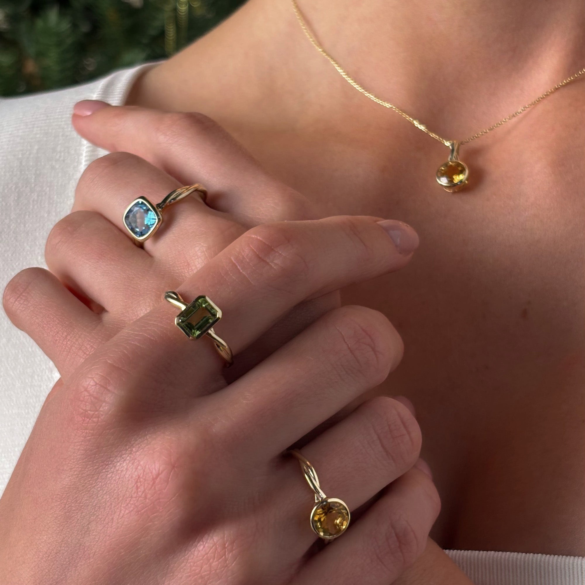 Emerald Cut Peridot Twist Bezel Set Ring in 9ct Yellow Gold