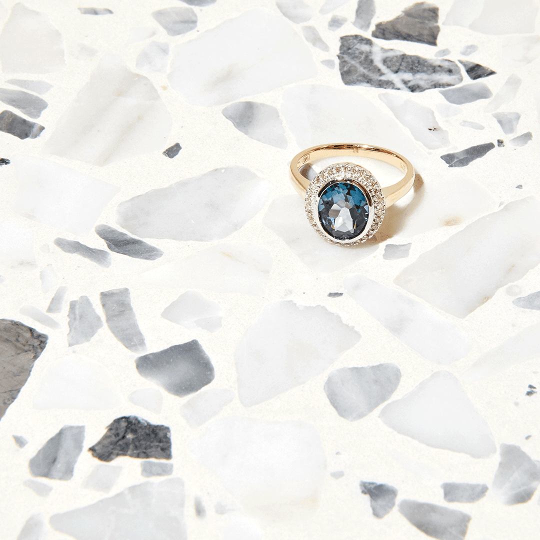 Blue Topaz & 0.15ct TW Diamond Dress Ring in 9ct Yellow Gold