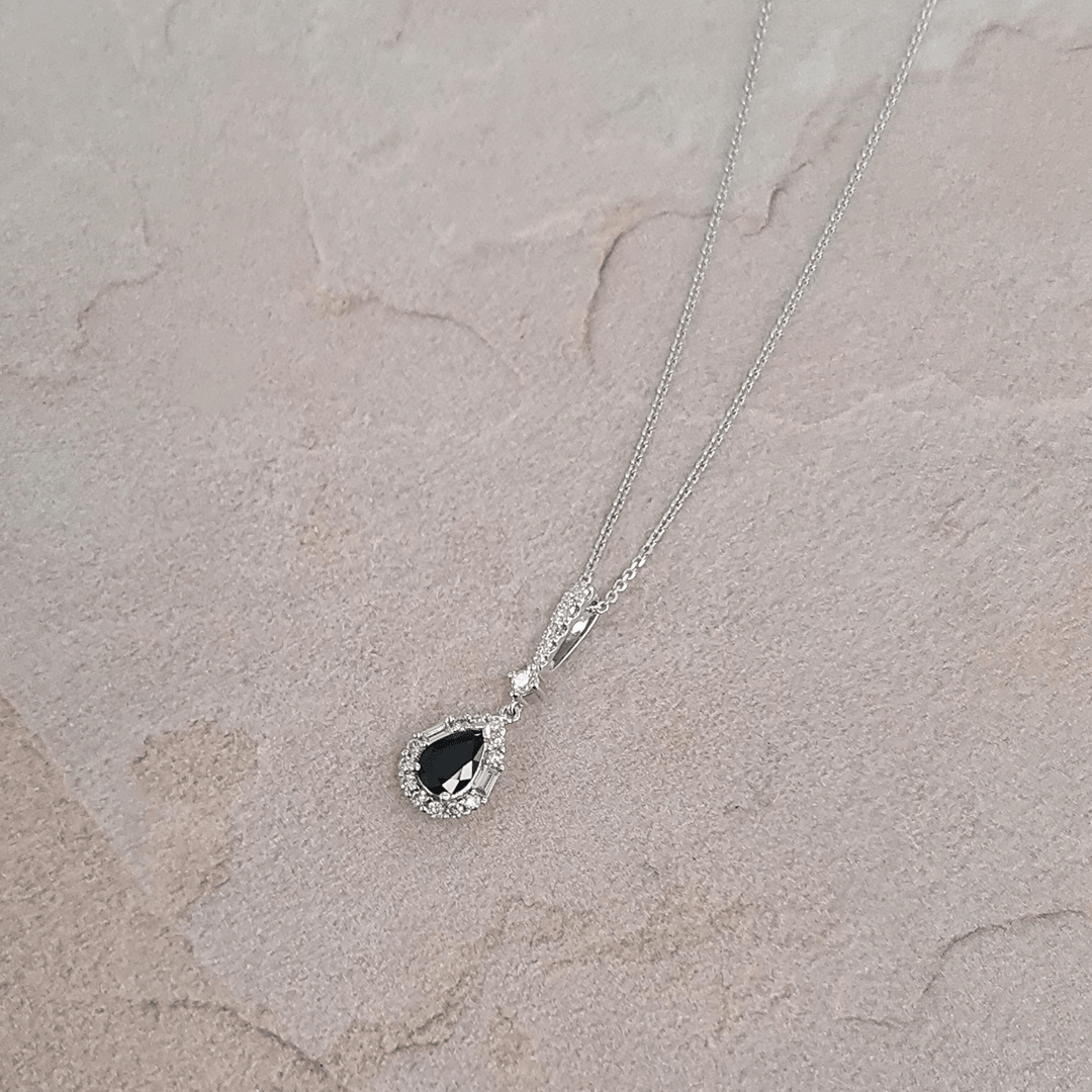 Bluebird™ Sapphire & 0.22ct Diamond Pear Halo Pendant with Chain in 9ct White Gold