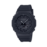 Casio G-Shock GA-2100-1A1 watch front view, featuring a 45.4mm all-black octagonal resin case with Carbon Core Guard construction, clean monochromatic analogue-digital dial with Arabic numeral indices, inverted LCD display, and distinctive integrated band design.