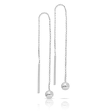 A pair of sterling silver thread-through drop earrings shown front on, featuring a comfortable round silver ball detail sitting 7mm from the ear. Designed for balanced, everyday wear.