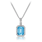 Emerald Cut Blue Topaz and Diamond Halo Pendant in 9ct White Gold