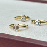 Everlasting 1.25ct TW Emerald Cut Lab-Grown Diamond Bezel Set Solitaire Engagement Ring in 18ct Yellow Gold