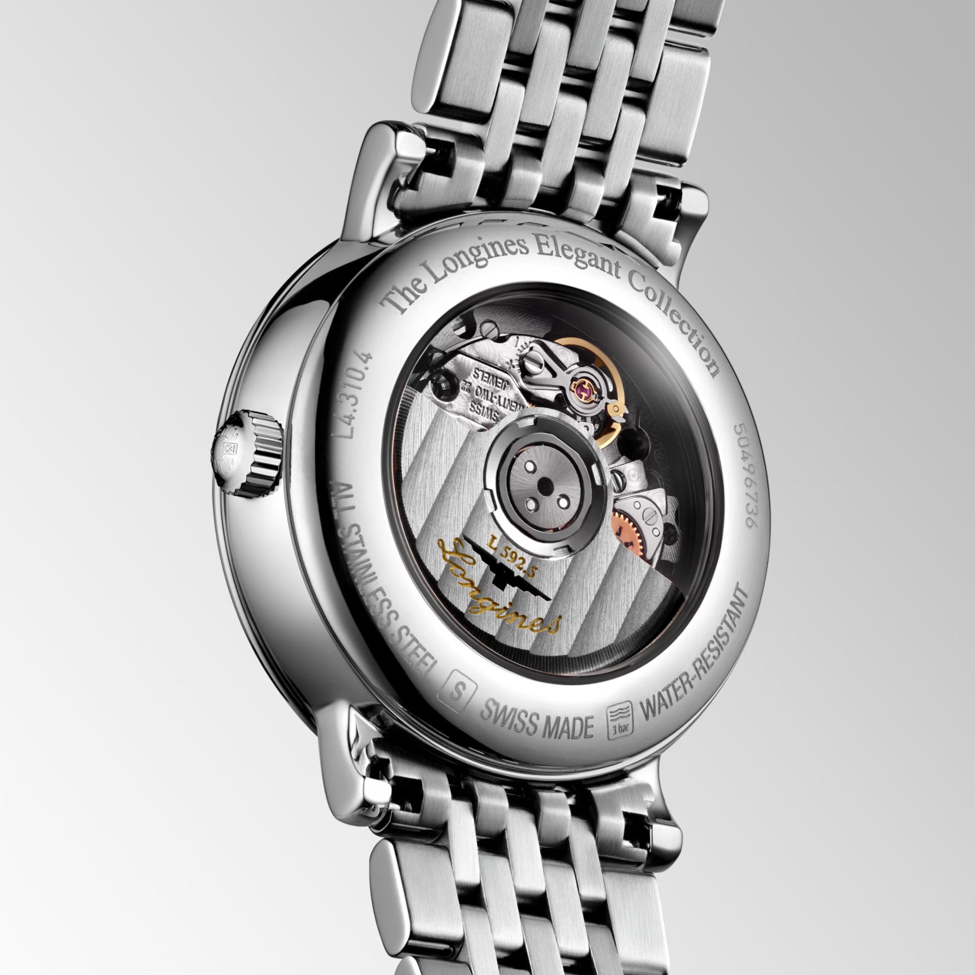 Close-up of the Longines Elegant 29mm case back, showing the smooth polished steel surface and detailed engravings including the model reference L4.310.4. The robust case construction provides water resistance to 3 bar while maintaining an elegantly slim profile.