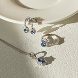 Tanzanite and Diamond Halo Pendant Necklace in 9ct White Gold