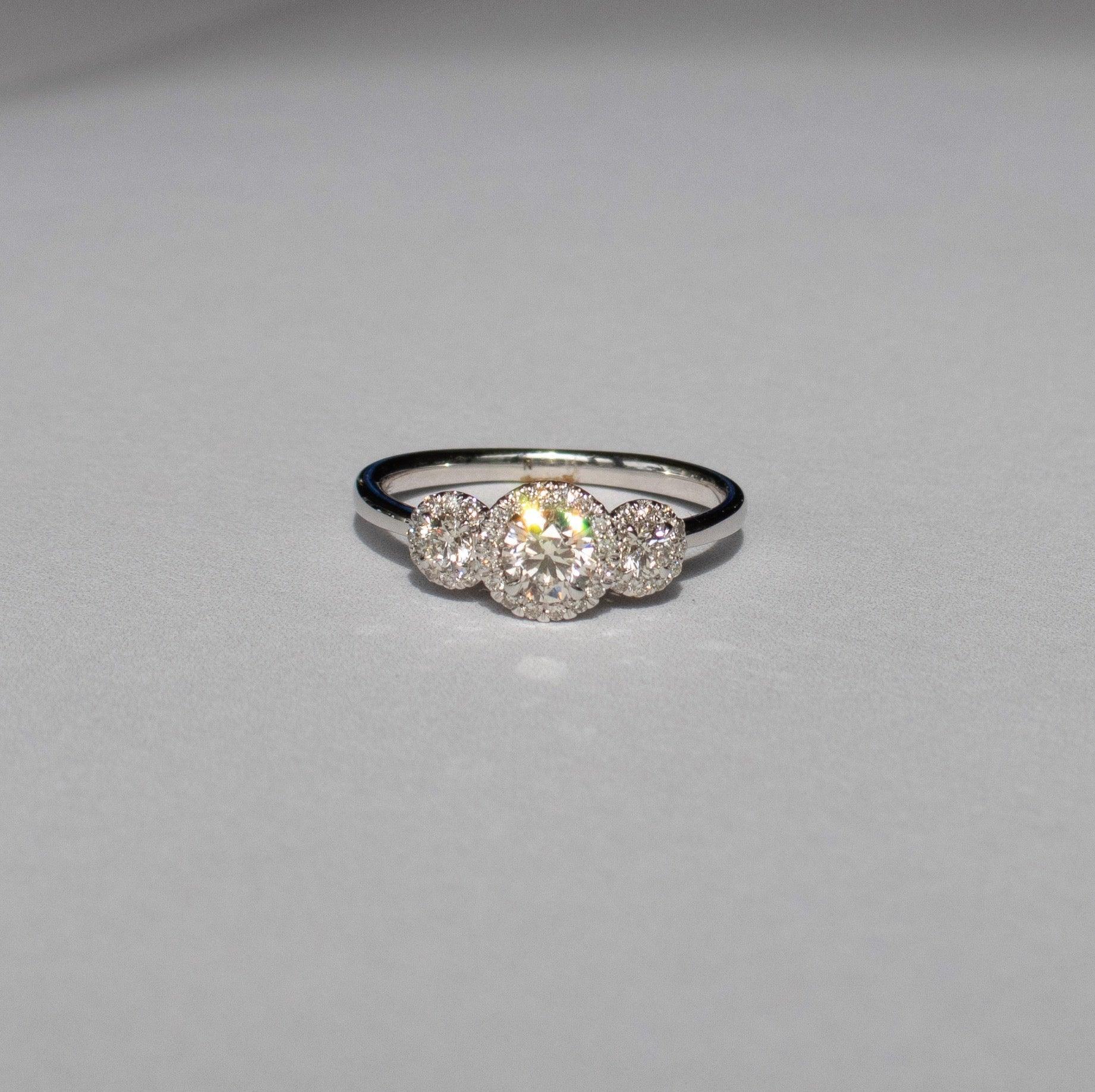 0.63ct TW Diamond Three Stone Halo Engagement Ring set in 9ct White Gold