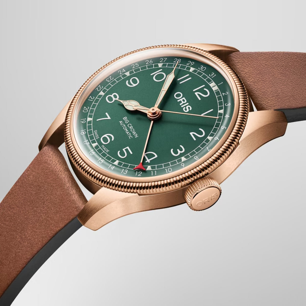 Side profile of the Oris Big Crown Limited Edition Men's 40mm Bronze Automatic Watch 754 7741 3167LS, showing the case depth and domed sapphire crystal. The brown leather strap and polished bronze bezel are visible along the watch's profile.