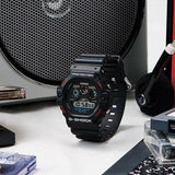 Casio G-SHOCK DW5900-1D digital watch with black resin band, triple graph display, and shock-resistant retro design.