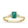 Front-on view of the Wallace Bishop 0.06 TDW Emerald-Cut Created Emerald & Diamond Ring in 9ct Yellow Gold, reference 38EMD040YO, on a plain polished band. The ring features a 6x4mm emerald cut created emerald centre stone flanked by a cluster of three round brilliant cut natural diamonds on each side.