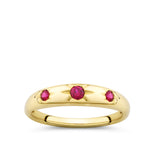 Front-on view of the Wallace Bishop Created Ruby Starburst Ring in 9ct Yellow Gold, reference 38RGSBRYO. Three round created rubies sit in a star hammer setting across the front of the tapered gold ring.