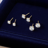 Flat lay view of three pairs of Wallace Bishop Essence Round Diamond Solitaire Stud Earrings in 9ct Yellow Gold, laid flat: the 0.15 TDW pair, reference 3EBRI016Y, measuring 2.70mm, the 0.46 TDW pair, reference 3EBRI048Y, measuring 5.20mm, and the 1.00 TDW pair, reference 3EBRI100Y, measuring 6.50mm. Each earring features a round diamond in a four-claw illusion setting.