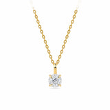 A classic solitaire necklace featuring a round brilliant-cut diamond pendant in a yellow gold four-prong setting, suspended from a matching yellow gold cable chain against a solid white background.