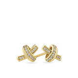 A pair of gold post earrings with a knotted cross design, embellished with rows of small clear pavé stones, shown on a plain white background.