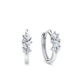 Front-on view of the Wallace Bishop Cubic Zirconia Scatter Huggies in Sterling Silver, reference 41ECZE01, with a 15mm huggie hoop. Each earring features a claw-set mix of baguette, marquise, pear and round cut white cubic zirconias for an asymmetric, scattered sparkle.