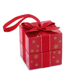 Front-on view of the Wallace Bishop Freshwater Pearl Earrings Bauble Gift Set in Sterling Silver, reference 41GIFT262, shown in its closed red gift bauble tied with a ribbon. The gift box is decorated with gold snowflakes and holds a pair of freshwater pearl earrings, ready to give.