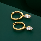 Flat lay view of the Wallace Bishop Marquise Cubic Zirconia Bezel Drop Earrings in 9ct Yellow Gold, reference 68MQE02, laid flat. Each earring has an 8mm huggie hoop with a bezel-set marquise cut white cubic zirconia drop measuring 6x3mm.