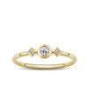 Front-on view of the Wallace Bishop Cubic Zirconia Trilogy Ring in 9ct Yellow Gold, reference 68RCZ18Y, on a petite polished gold band. The ring features a bezel-set round cubic zirconia centre stone flanked by two smaller claw-set cubic zirconias, forming a trilogy design in yellow gold.
