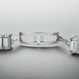 The 40mm stainless steel case sits confidently on the wrist, showing the black dial and oversized screw-down crown at the 3 o'clock position. The H-link bracelet fits closely and comfortably against the skin.