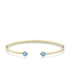 Front-on view of the Wallace Bishop London Blue Topaz Flexi Bangle in 9ct Yellow Gold, reference 93BGLTBY, a cuff-style bangle measuring 50mm by 60mm. The bangle features a bezel-set 5x4mm natural pear-cut London blue topaz on each side.