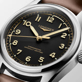 Longines watch with black dial and gold accents