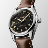 Longines watch with brown leather strap and black dial