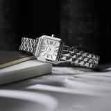 Silver Timex watch with a white dial