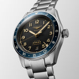 Silver Longines watch with black dial and blue accents