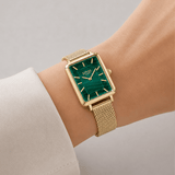 The Loyal Academy Gold PVD Women's Watch worn on the wrist, showing the true scale of the 24.50mm case and malachite stone dial. The Gold PVD finish and mesh bracelet give this quartz watch a polished, versatile look for daily wear.