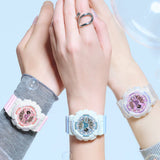 Three hands wearing colorful Casio Baby-G Watches 