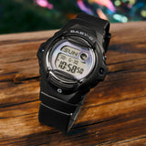 Lifestyle shot of the Casio Baby-G Digital Women's Watch BG169GD-1D, 42mm case, styled in an everyday casual setting. The matte black finish and compact round silhouette are shown in a natural, real-world context.