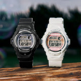 The Casio Baby-G Digital Women's Watch BG169GD-7D, 42mm case, worn alongside the Casio Baby-G Digital Women's Watch BG169GD-1D on a second wrist. The matte off-white and black colourways are shown side by side for comparison.