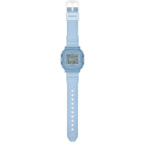 The Casio Baby-G BGD10KG-2D is fitted with a translucent blue glitter resin band with the included customisable silicone holder with acrylic panels shown alongside, confirming shock-resistant and 100-metre water-resistant construction.