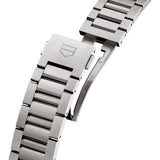 TAG Heuer Carrera Chronograph Extreme Sport CBU2081.BF0007 photographed in close-up focusing on the titanium folding clasp with double safety push-buttons. The H-shape bracelet links are visible connecting to the clasp mechanism.