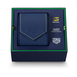 A Senna x Tag Heuer Formula 1 Special Edition leather wallet in navy blue, presented inside its branded dark blue gift box with green trim.