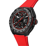 A black TAG Heuer Formula 1 Chronograph watch with a red strap and red accents on the watch face.