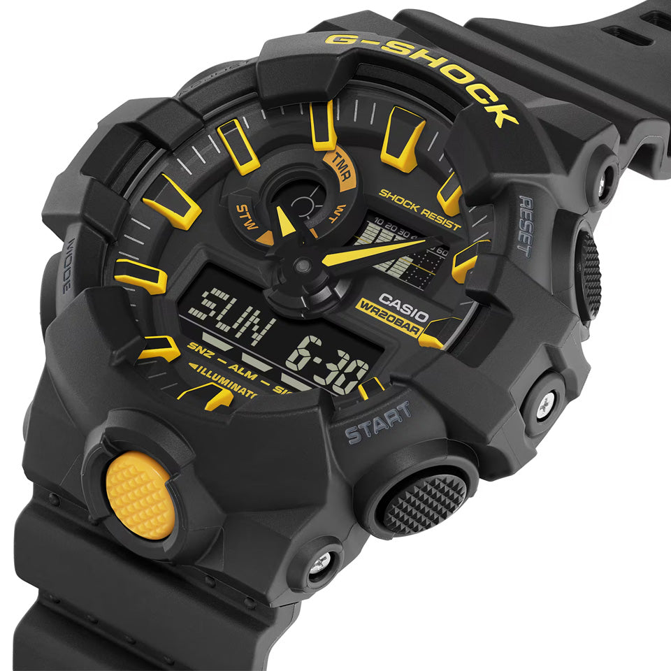Casio G-SHOCK GA700CY-1A analogue digital watch with black resin band, oversized black and yellow dial, and shock-resistant design.