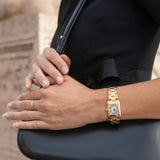 Frederique Constant Carrée Quartz Women's Watch FC-200MCDC25B styled in a lifestyle setting, reflecting its Art Déco-inspired, jewellery-led design suited to dressier occasions. The diamond bezel and gold-tone finish complement a refined, feminine look.