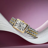 Frederique Constant 28mm Quartz Watch FC-200MPW2AC3B styled in a lifestyle setting, reflecting its Art Déco-inspired, jewellery-led design suited to dressier occasions. The gold-tone finish and mother-of-pearl dial complement a refined, feminine look.