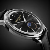 Frederique Constant 37mm Quartz Moonphase Watch FC-206B3S6 styled in a lifestyle setting, reflecting its understated, classic design suited to both business and casual wear. The black dial and leather strap complement a refined, versatile look.