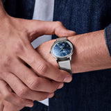 Frederique Constant Classic Quartz 37mm Watch FC-206N3S6B worn on the wrist, demonstrating the comfortable fit of its 37mm case and Milanese mesh bracelet. The moonphase display adds a subtle decorative detail to the wrist.