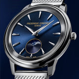Frederique Constant Classic Quartz 37mm Watch FC-206N3S6B styled in a lifestyle setting, reflecting its refined, versatile design suited to both professional and evening occasions. The navy blue dial and Milanese mesh bracelet complement a sophisticated, understated look.