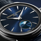 Frederique Constant 37mm Quartz Moonphase Watch FC-206N3S6 styled in a lifestyle setting, reflecting its refined, versatile design suited to both business and evening occasions. The navy blue dial and leather strap complement a sophisticated, understated look.